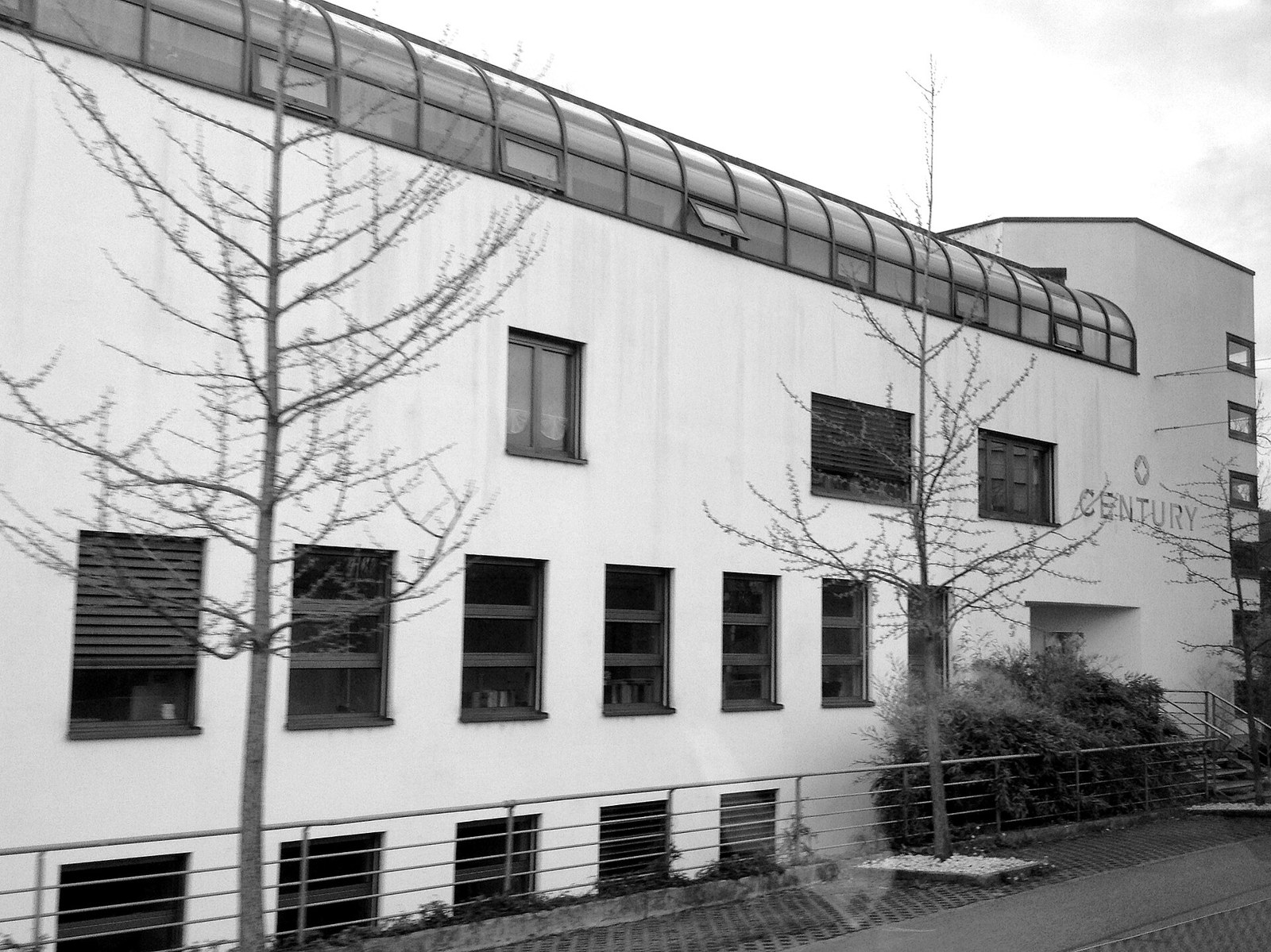 White modern watch factory building in Nidau, near Biel, Switzerland, in black and white